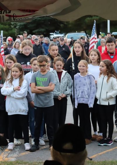 service members standing in formation at a send-off ceremony